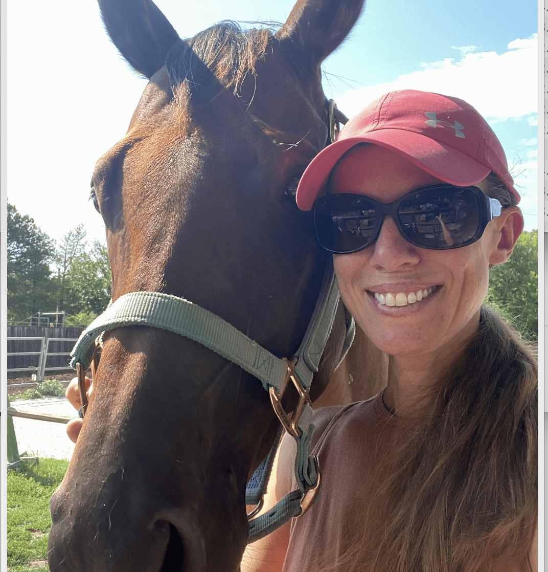 Dr Nicki Wise posing with her horse.